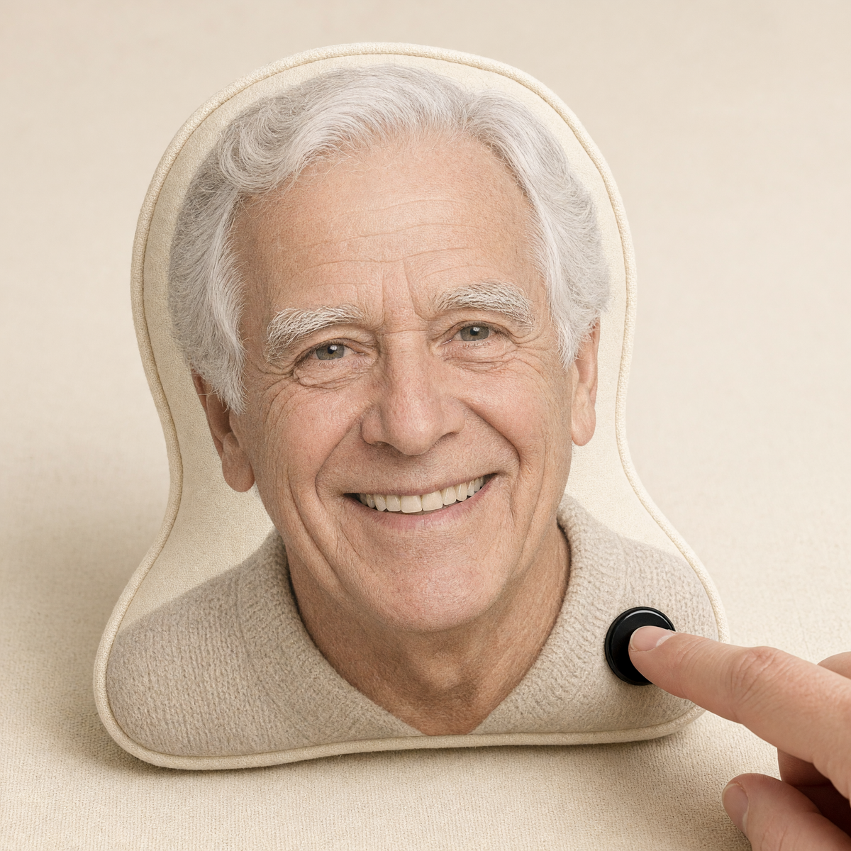 Finger pressing the voice chip on a photo-shaped pillow